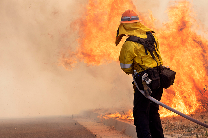 Firefighter extinguishes wildfire